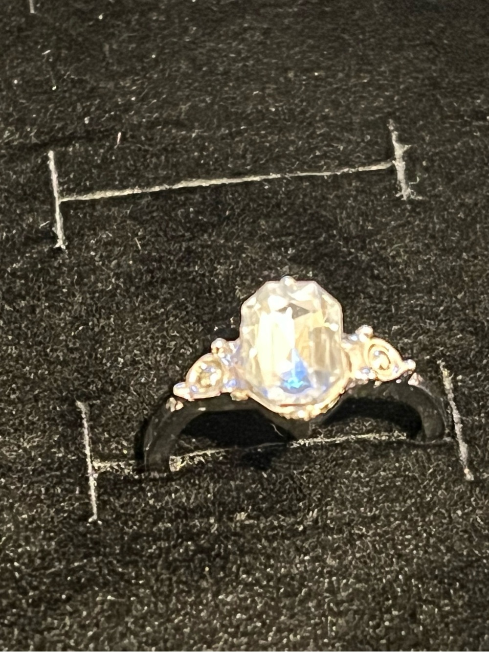 Elegant Silver-Tone Ring with Clear Center Stone and Accent Details - Clear